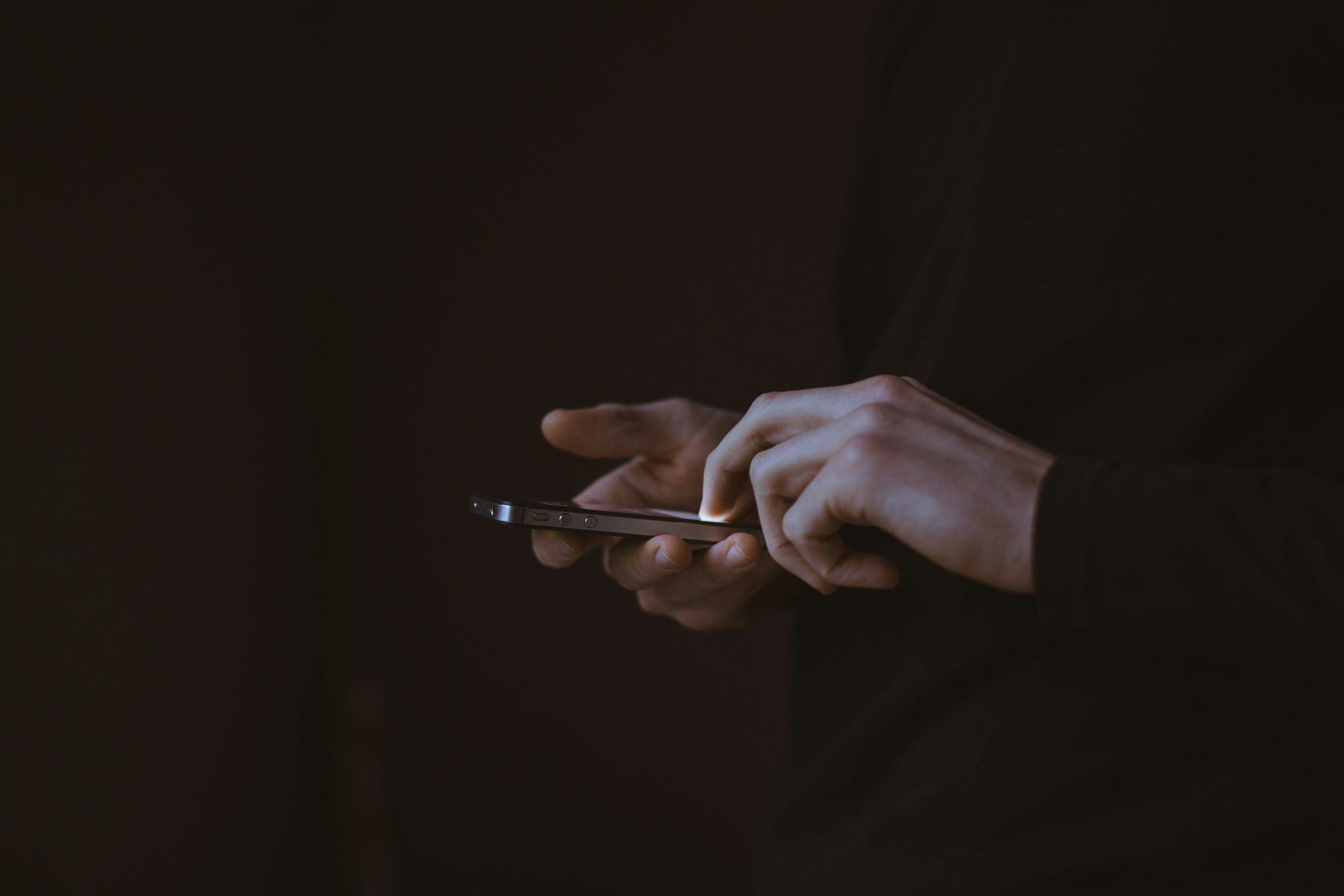 Person messaging on a phone