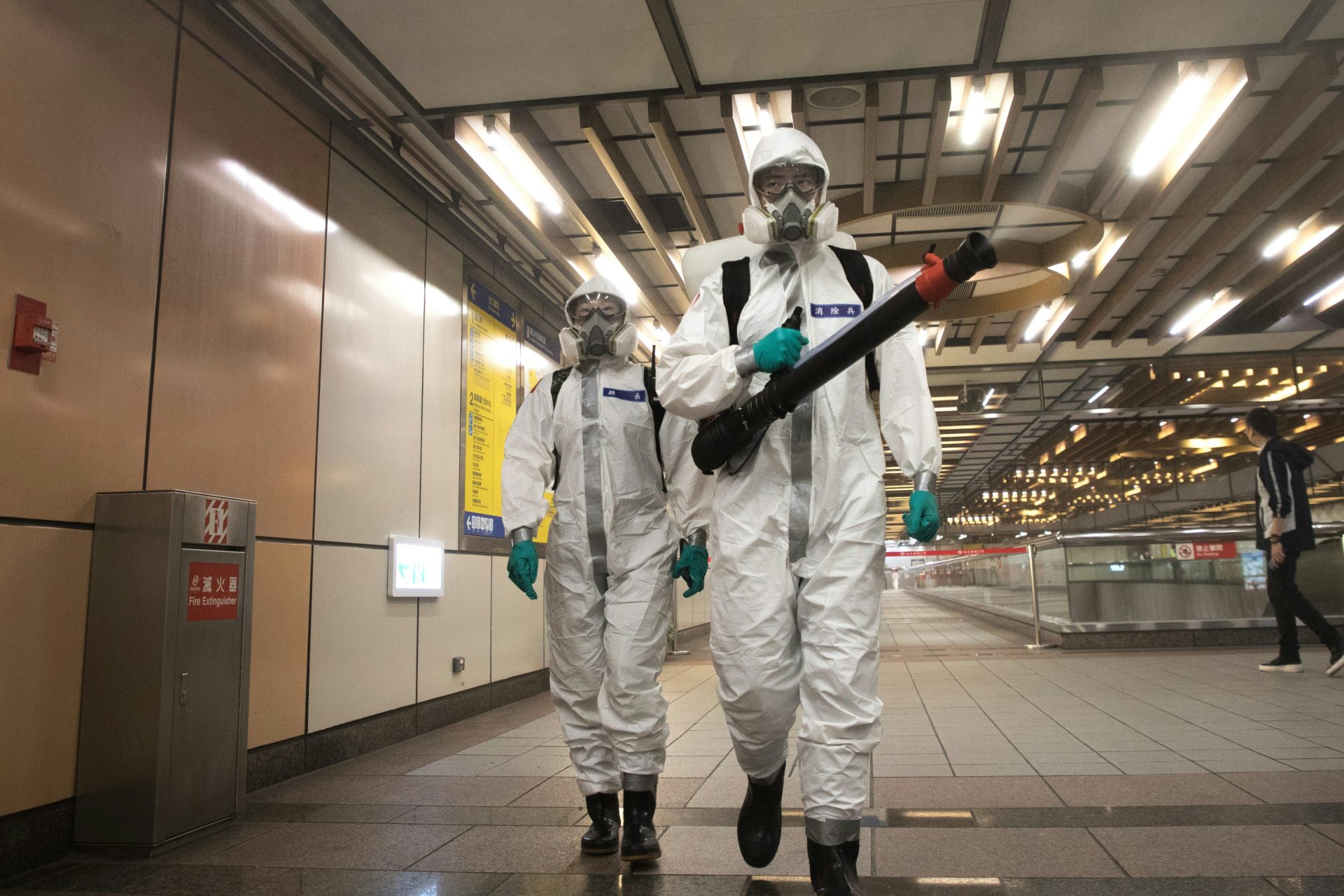 Biohazard technicians in full PPE